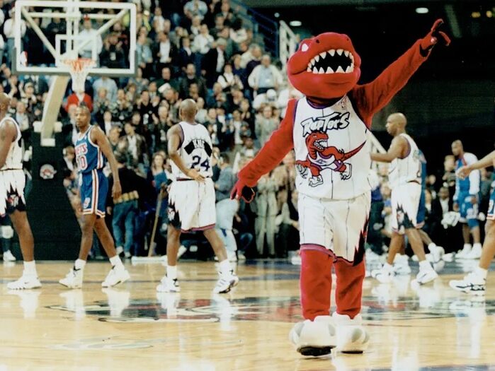The Raptors mascot's big energy, taken during the team's inaugural game. Image taken by Dick Loek and sourced from the Toronto Star.