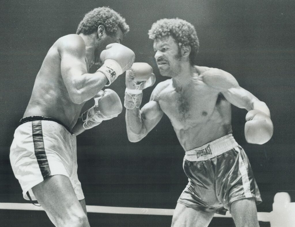A photograph of Clyde Gray and Jose Napoles facing off, published by the Toronto Star on September 23, 1973. The caption reads: "Ready, get set . . . Toronto's Clyde Gray has his left hand ready to throw punch at world welterweight champion Jose Napoles, left, during their title fight at Maple Leaf Gardens Saturday night. Champion won a unanimous decision, but Gray made it exciting with flurries in the middle round and the final one. Toronto boxer earned only $20,000 for the bout, but says his days of $3,000 fights are over." Image by Fred Ross and sourced from the Toronto Public Library.