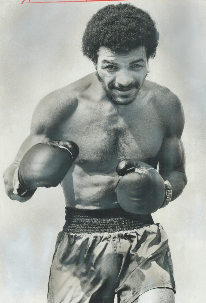 A photograph of Toronto boxer Clyde Gray, published in the Toronto Star on August 27, 1973. The caption reads: "Clyde Gray is in superb condition for the biggest fight of his life tomorrow when the challenges world welterweight titleholder Jose Napoles at Maple Leaf Gardens. For bricklayer and truck driver Gray, victory means a rich life." Image by Boris Spremo and sourced from the Toronto Public Library.