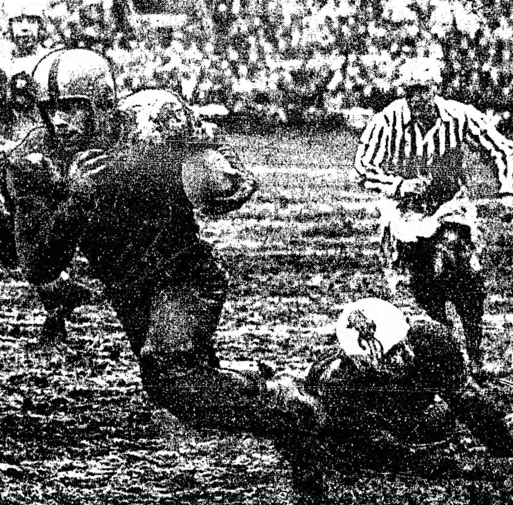 A photograph from a full page article of The Globe and Mail on the Toronto Argonauts' Grey Cup (aka. Mud Bowl) victory on November 27, 1950. Article written by Hal Walker, photograph taken by Harry McLorinan, and sourced from Newspapers.com.