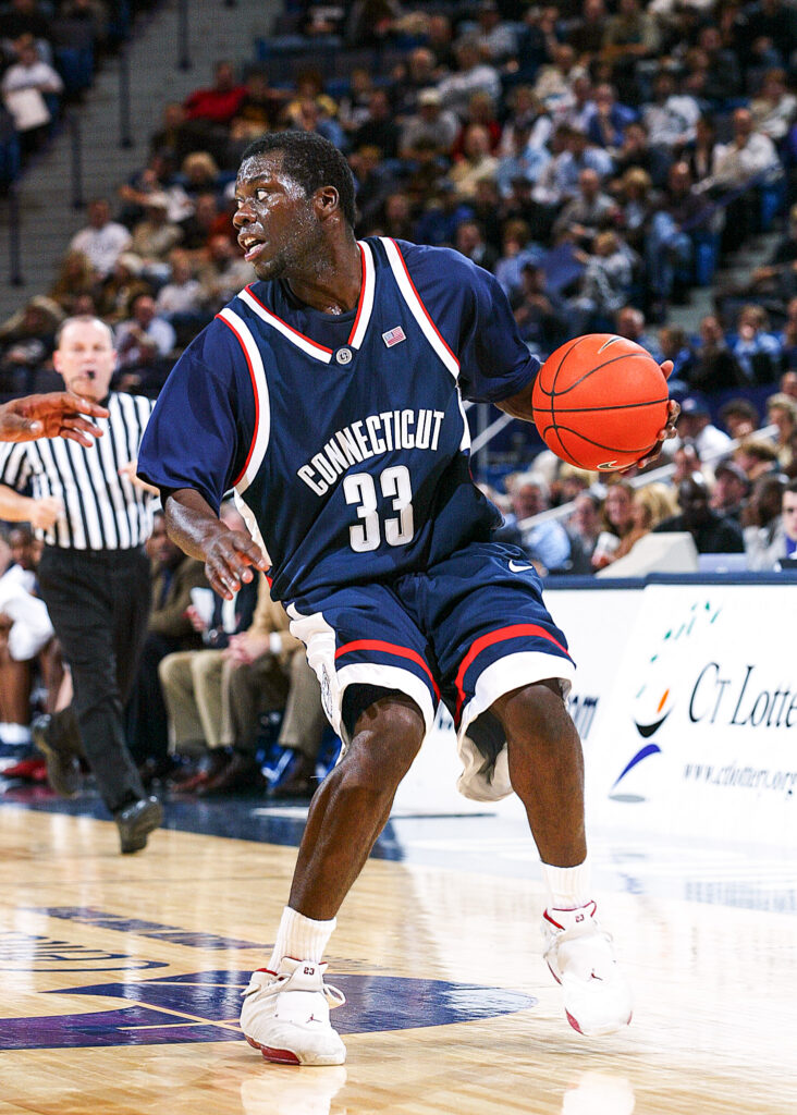 A photograph of basketball player Denham Brown during his 2003-2004 season with the UConn (University of Connecticut) Huskies. Sourced from UConn Men's Basketball social media.